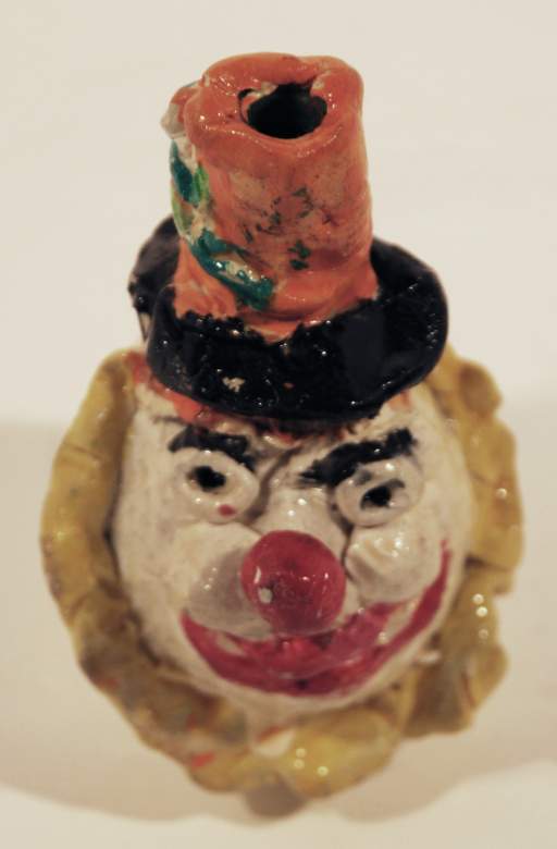 Untitled [Clown with orange and black top hat]