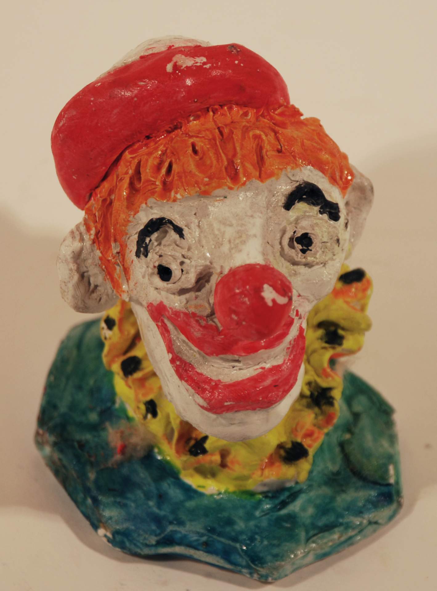 Untitled [Clown with white and red hat]