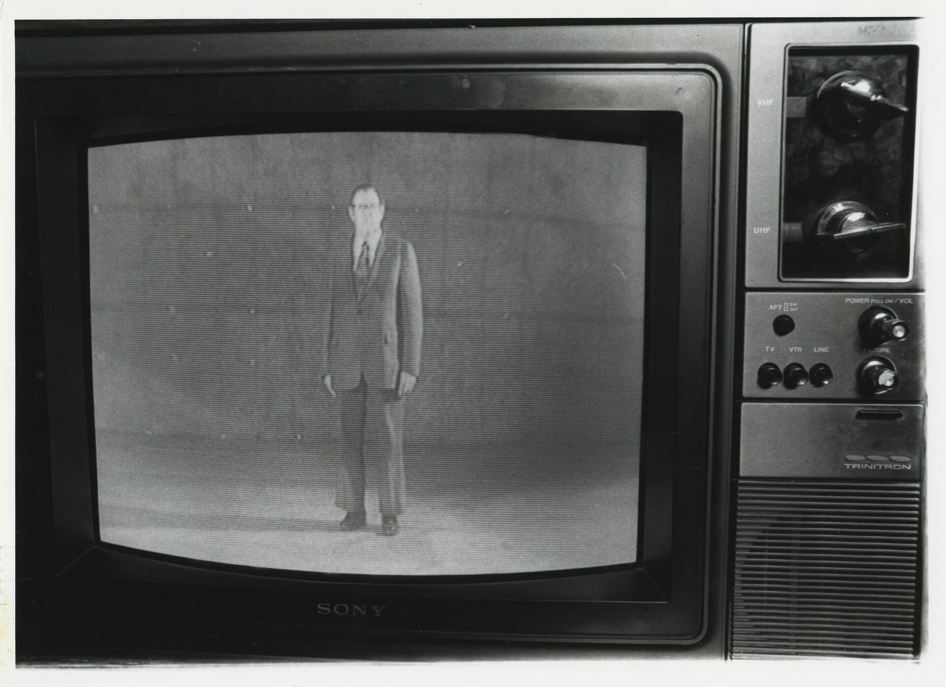 [Gerald O'Grady on a television screen]