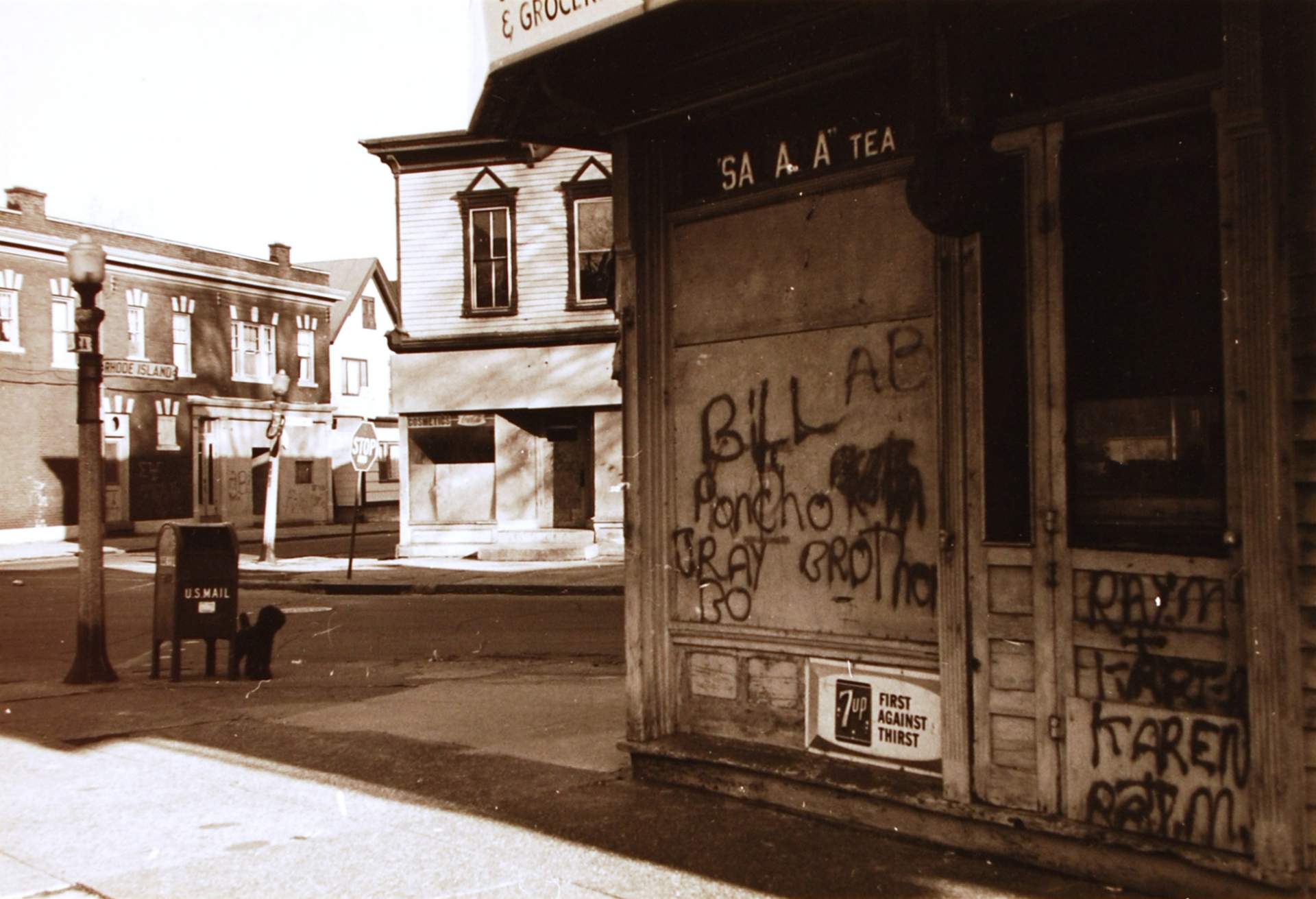 Untitled [Buffalo; graffiti on store]