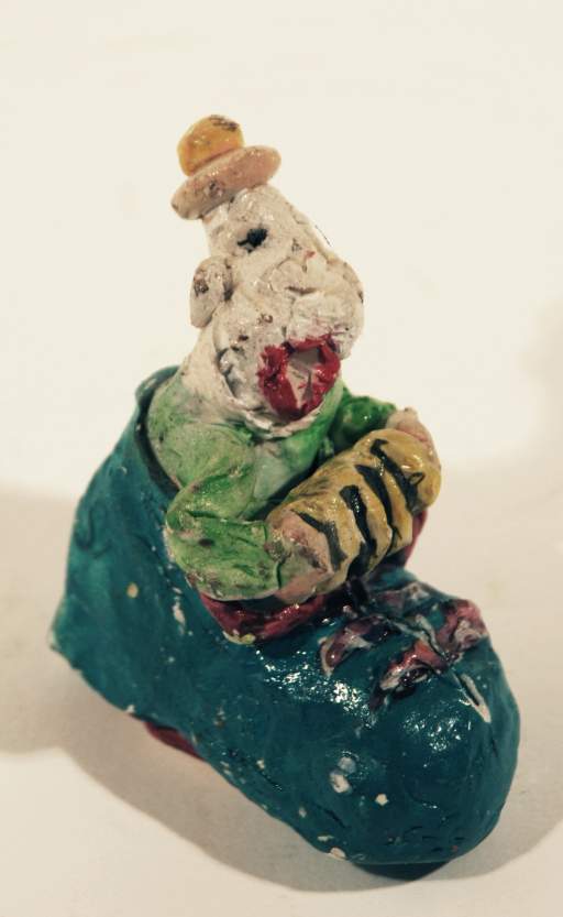 Untitled [Clown in a shoe playing the accordian]