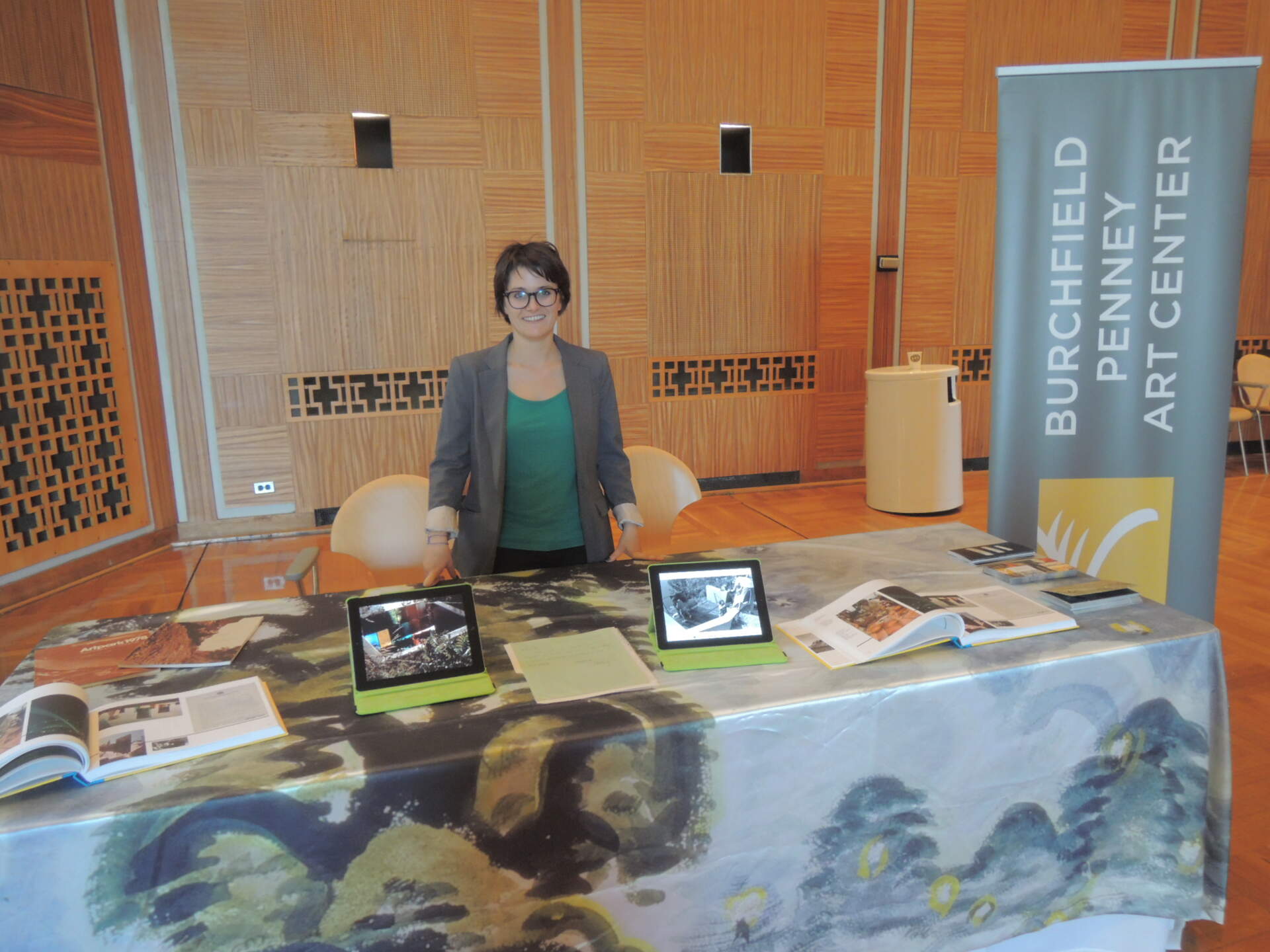 Archivist Heather Gring looking very pleased with her table about Dale Chihuly at the BPO
