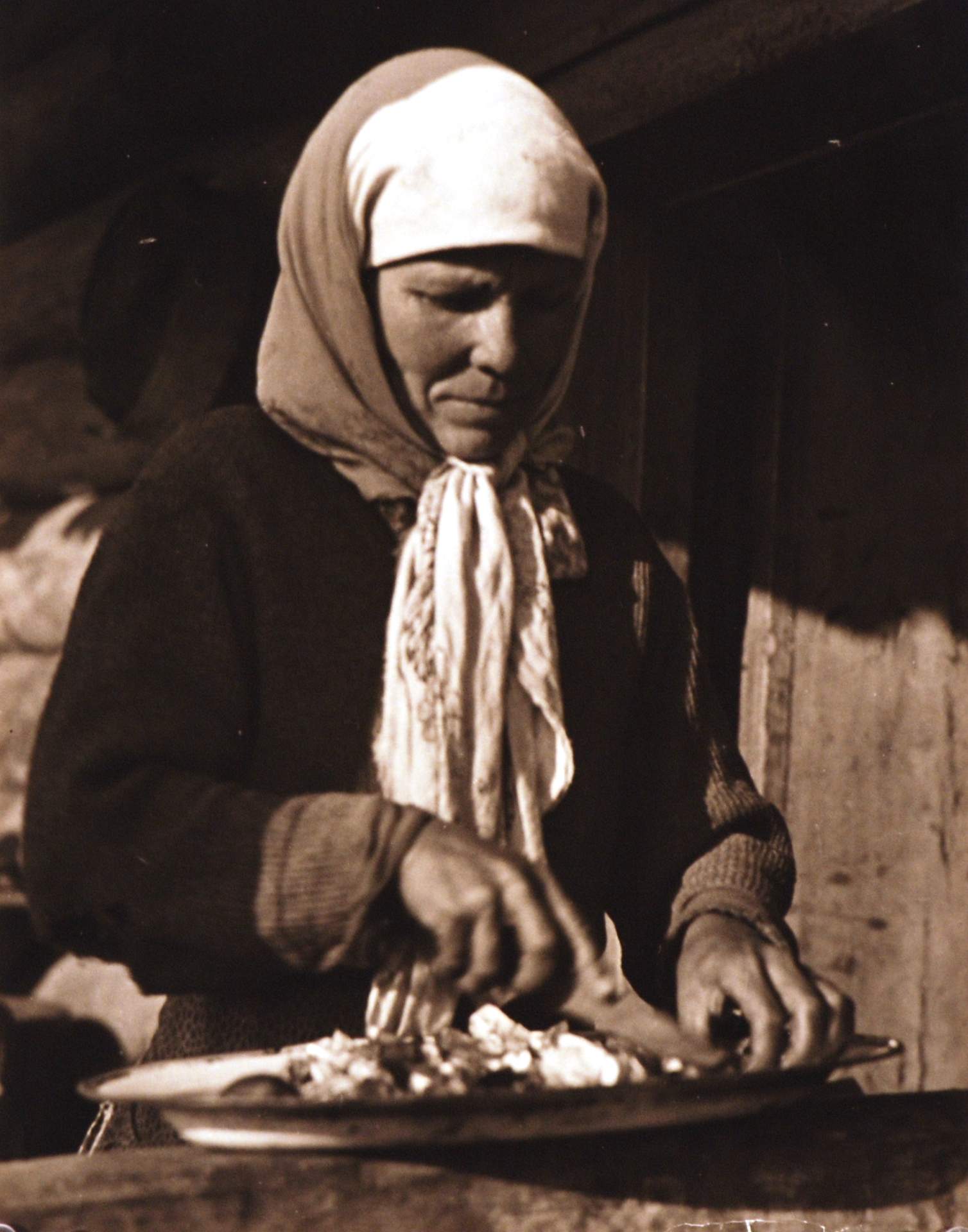 Untitled [woman cutting vegetables]